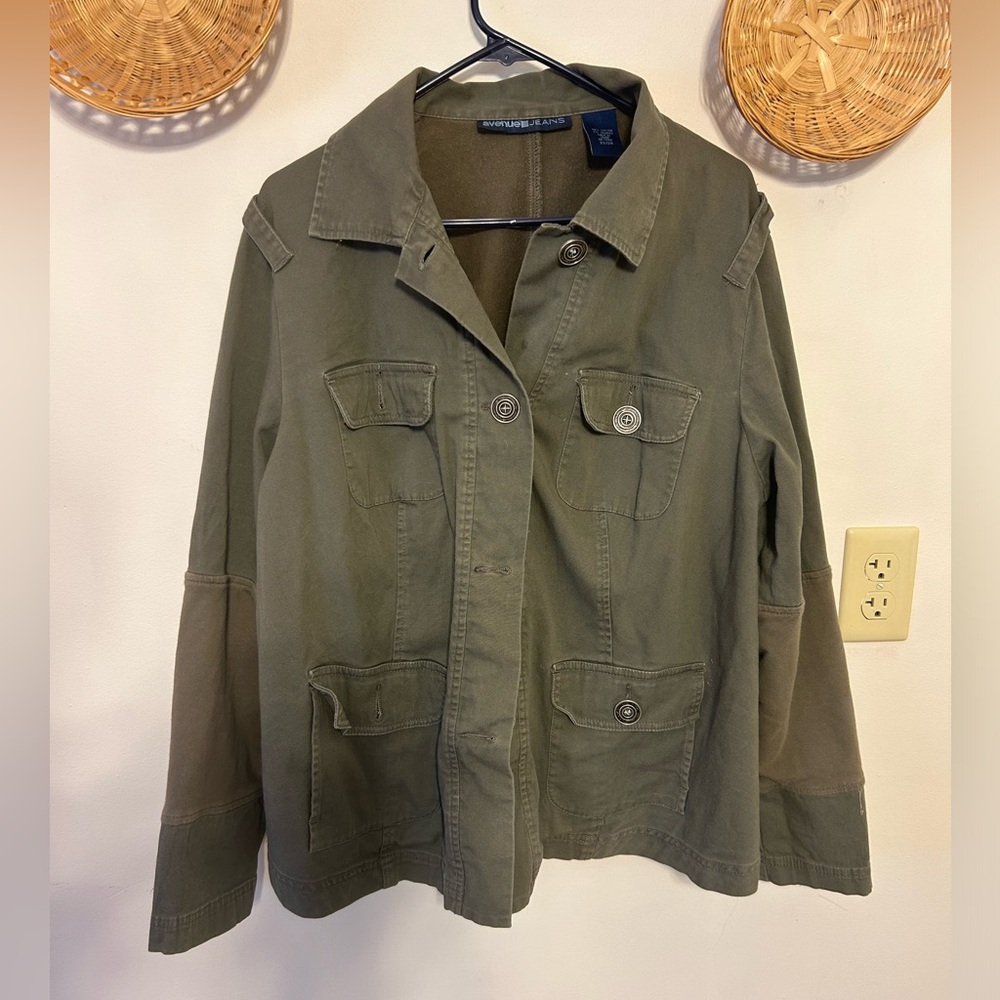 Green jean jacket with cotton patches on the arms and on the back
